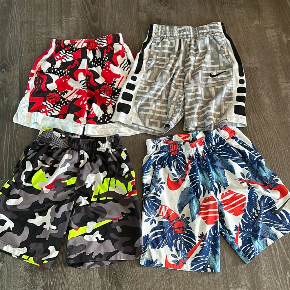 4 pairs of youth medium Nike shorts.